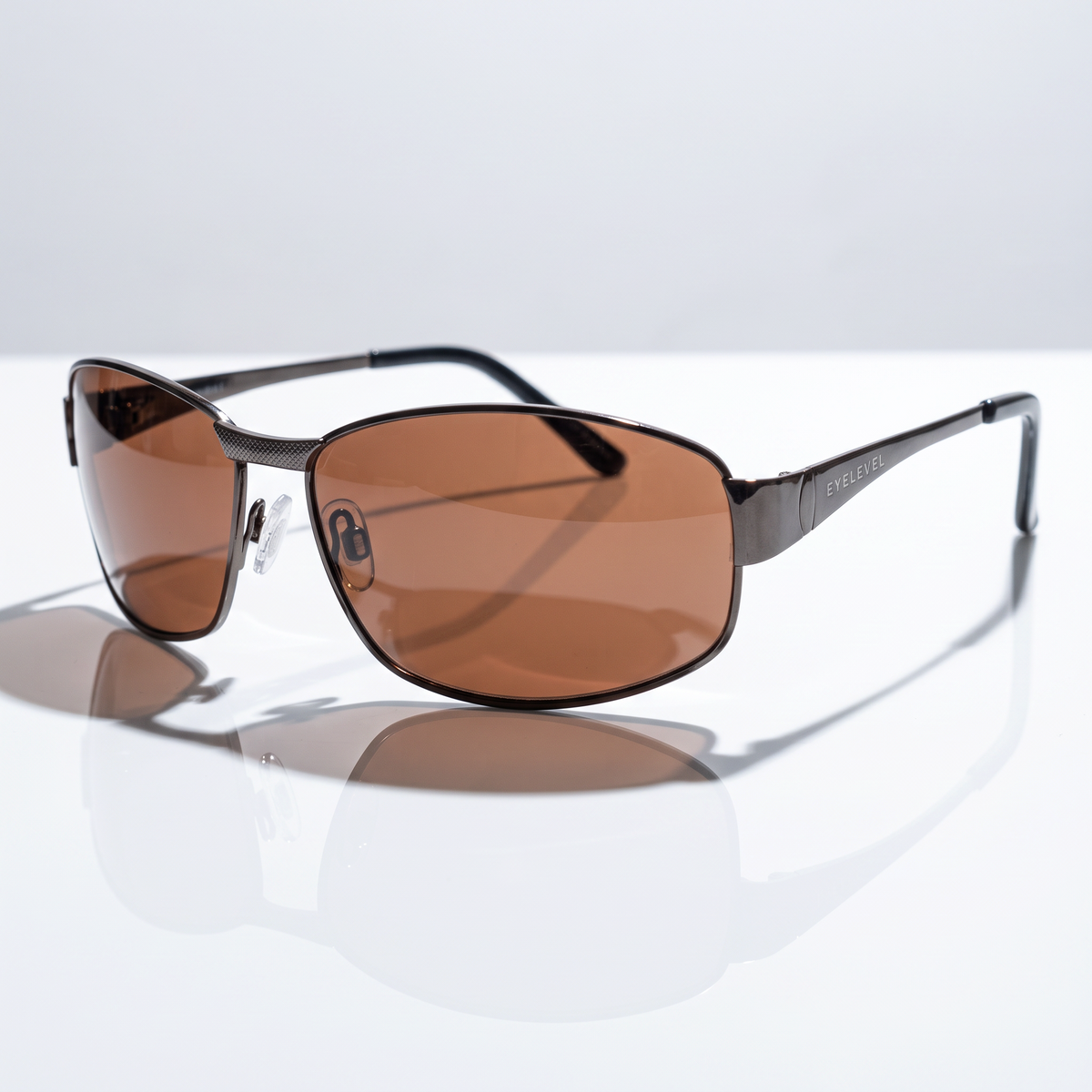 Eyelevel-UK Accelerate driving sunglasses with gunmetal frame and polarized copper lenses for reduced road glare.