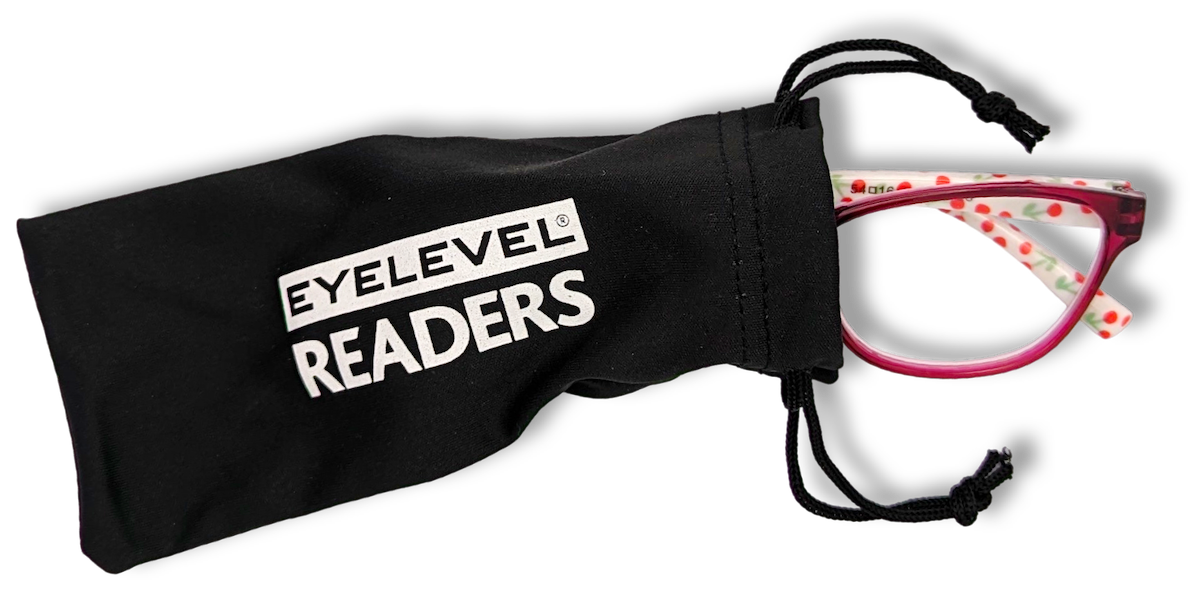 Eyelevel-UK Aruba bright pink reading glasses with floral pattern arms inside a black branded drawstring pouch.