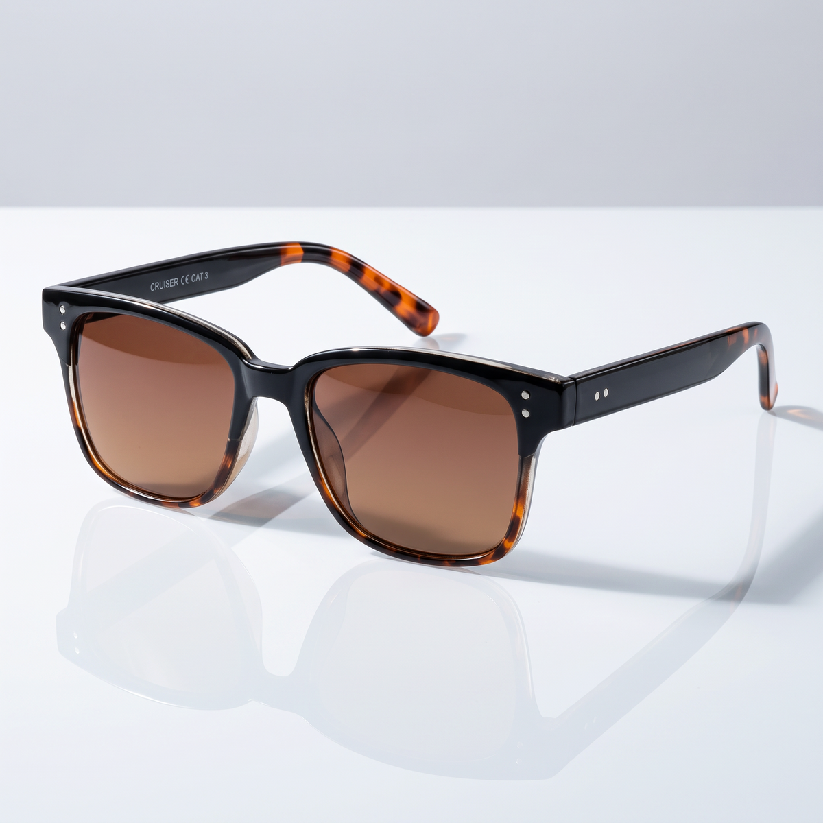 Eyelevel-UK Cruiser driving sunglasses with black and tortoiseshell frame and high density brown tinted lenses.