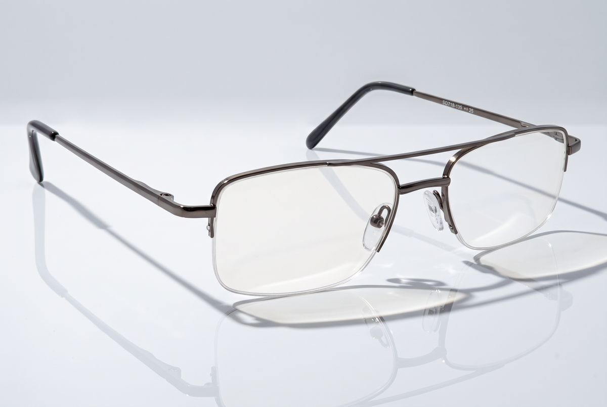 Eyelevel-UK Cuba reading glasses with a grey metal semi-rimless rectangular frame and clear magnifying lenses.