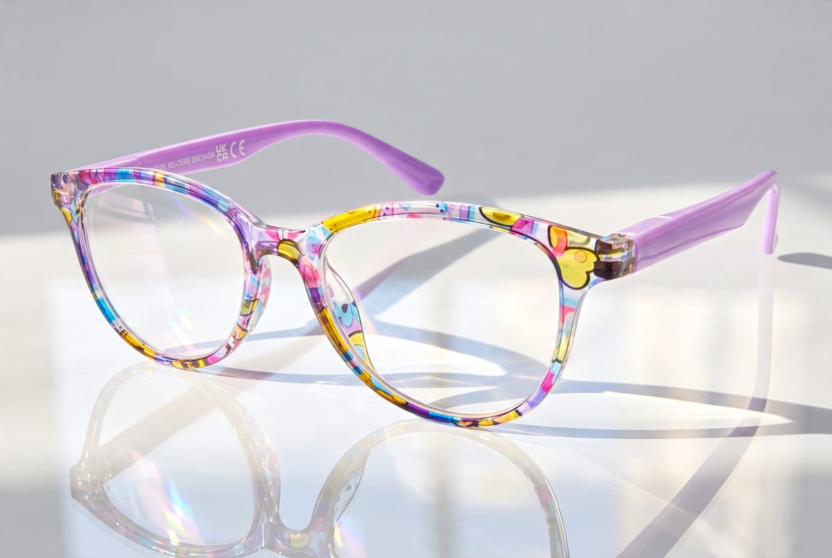Eyelevel-UK Grenada reading glasses with a colourful lilac and yellow patterned frame and clear magnifying lenses