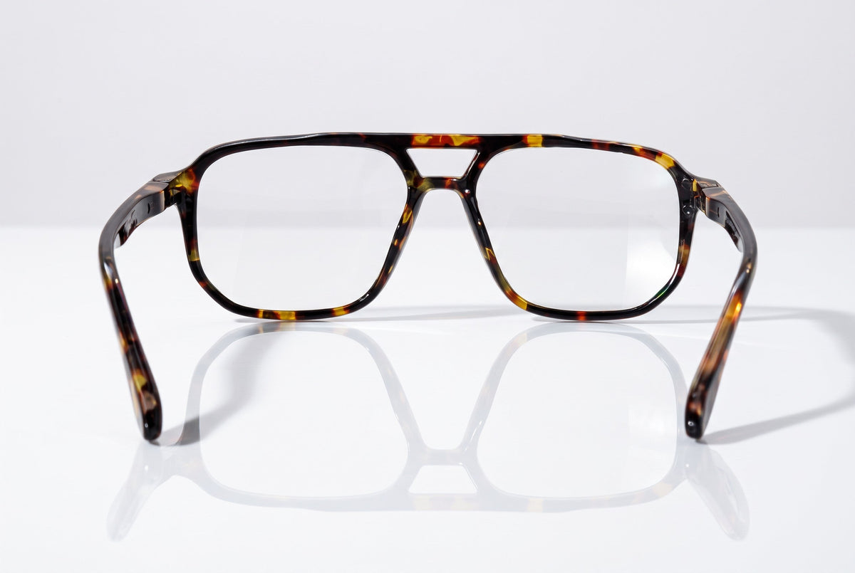 Eyelevel-UK Lancaster brown tortoiseshell square reading glasses with clear lenses on a reflective white surface