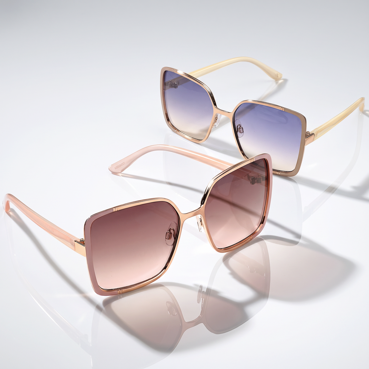 Eyelevel-UK Mya oversized geometric sunglasses in rose gold with pink and beige frames and gradient lenses.