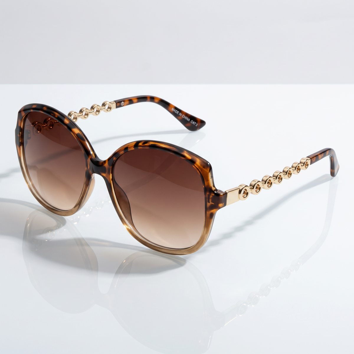 Eyelevel-UK Natalie oversized geometric sunglasses in brown tortoiseshell and cream with gold chain-link arms