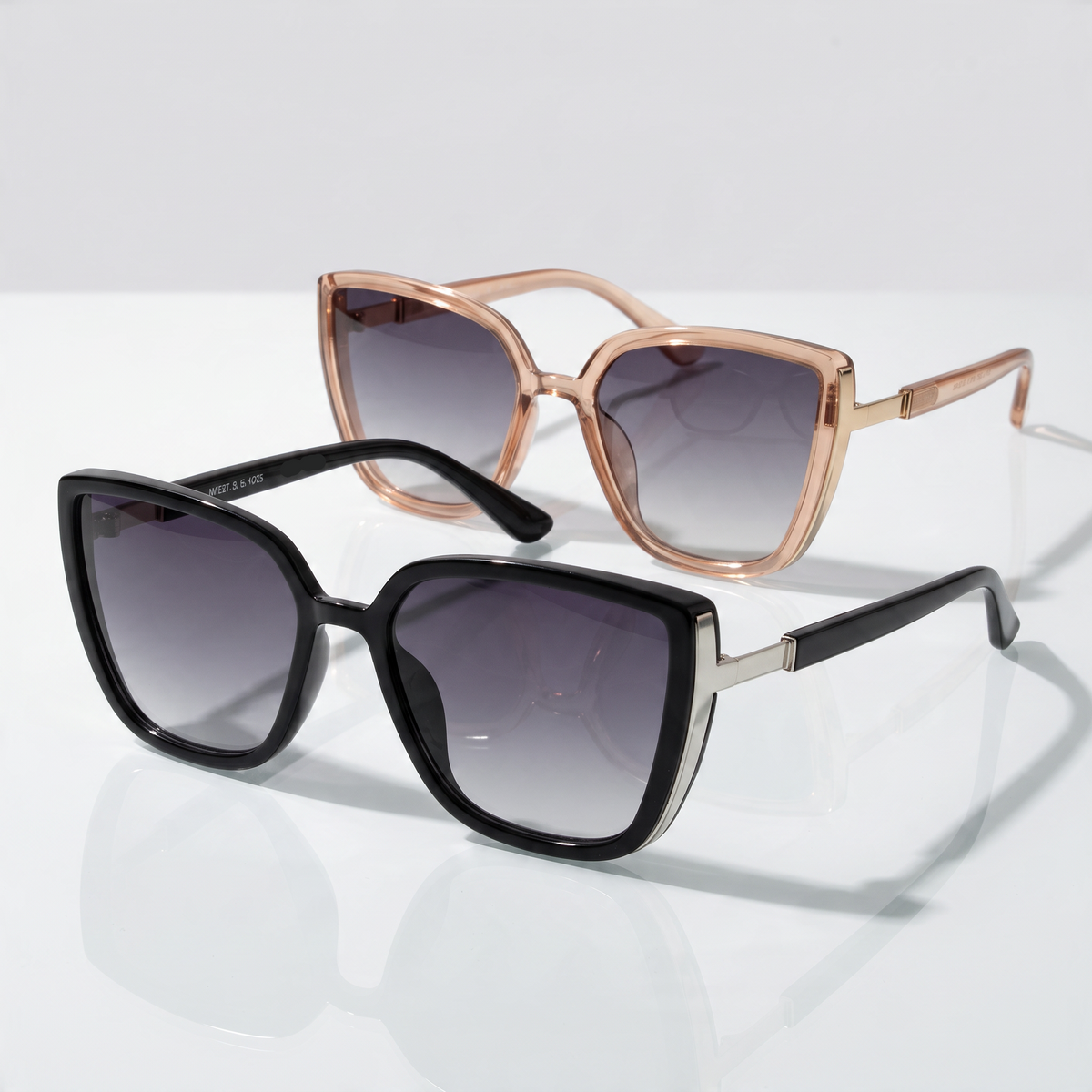 Eyelevel-UK Nicole oversized fashion sunglasses in brown crystal and black with grey gradient lenses on a white surface.