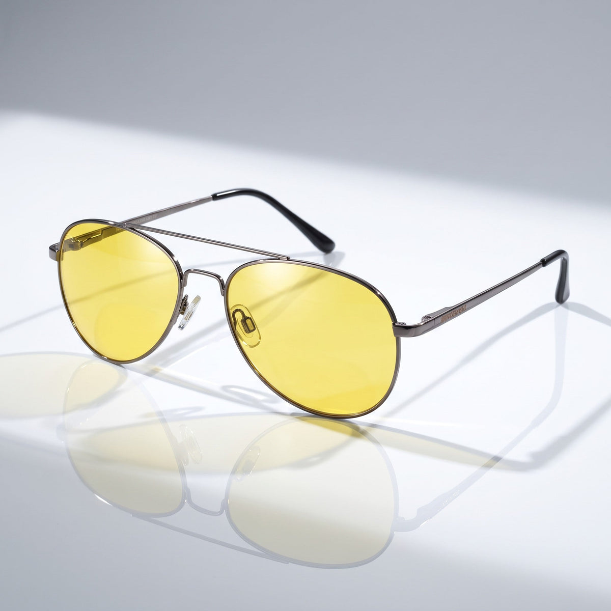 Eyelevel-UK Night Driver 1 sunglasses with gunmetal aviator frames and yellow lenses for low-light driving conditions.