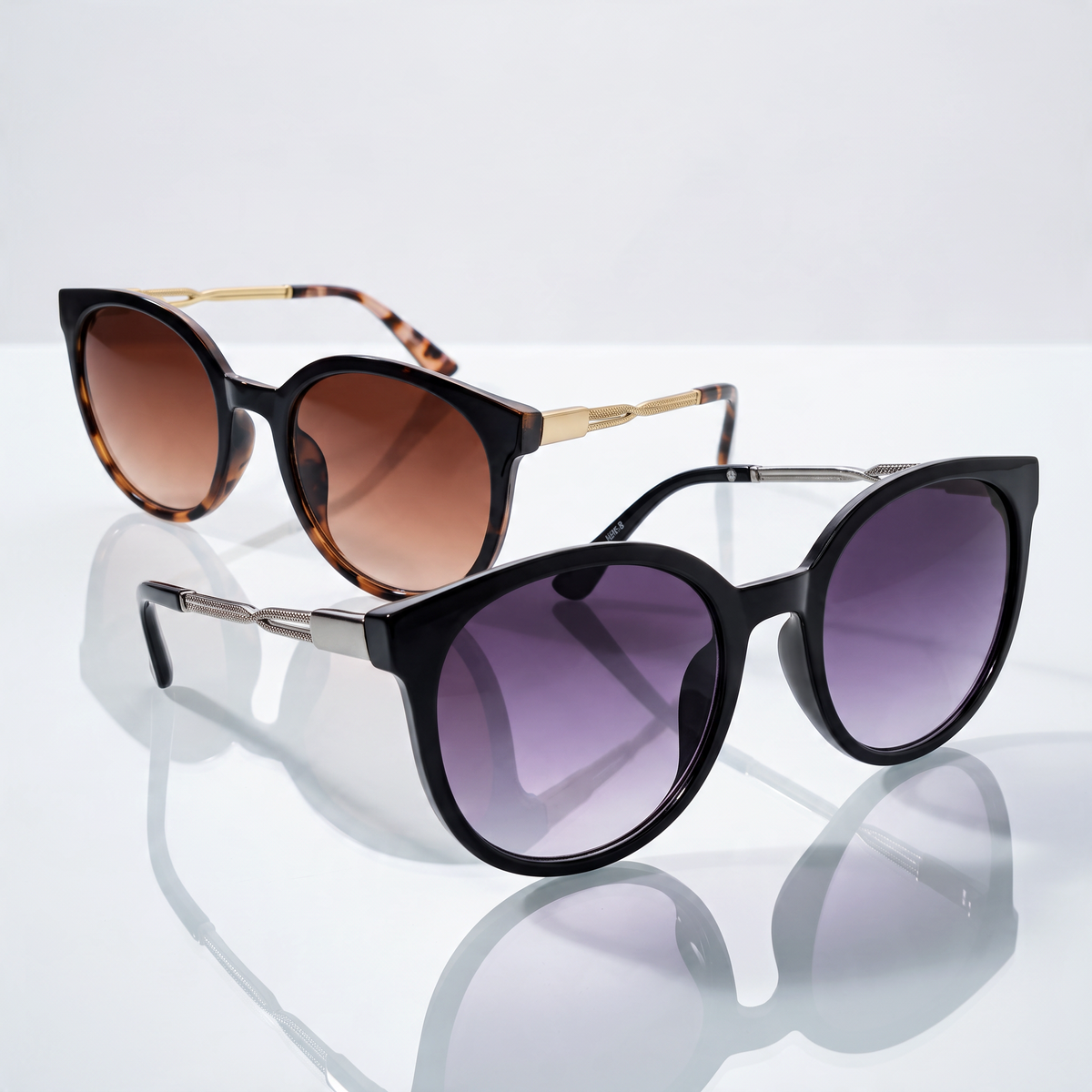 Eyelevel-UK Robyn oversized round sunglasses in brown tortoiseshell and black with gradient lenses on a reflective base