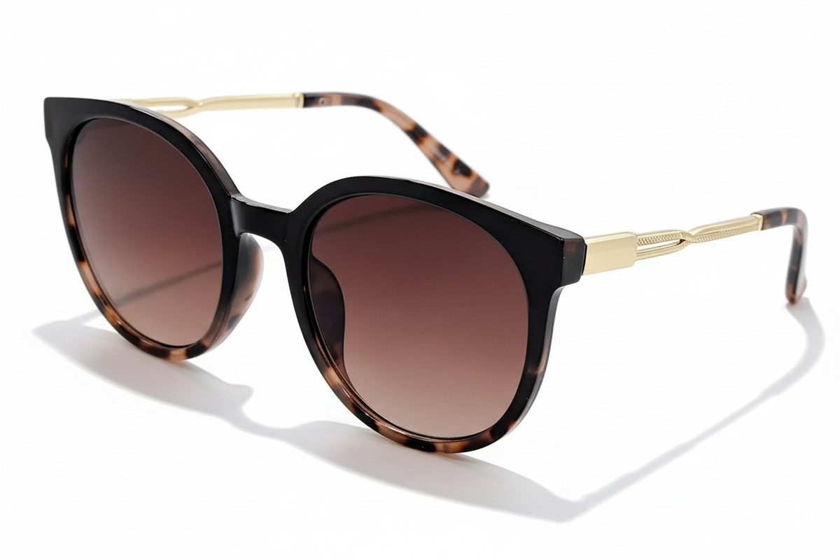 Eyelevel-UK Robyn oversized round sunglasses with brown tortoiseshell frame, gold temples, and brown gradient lenses.