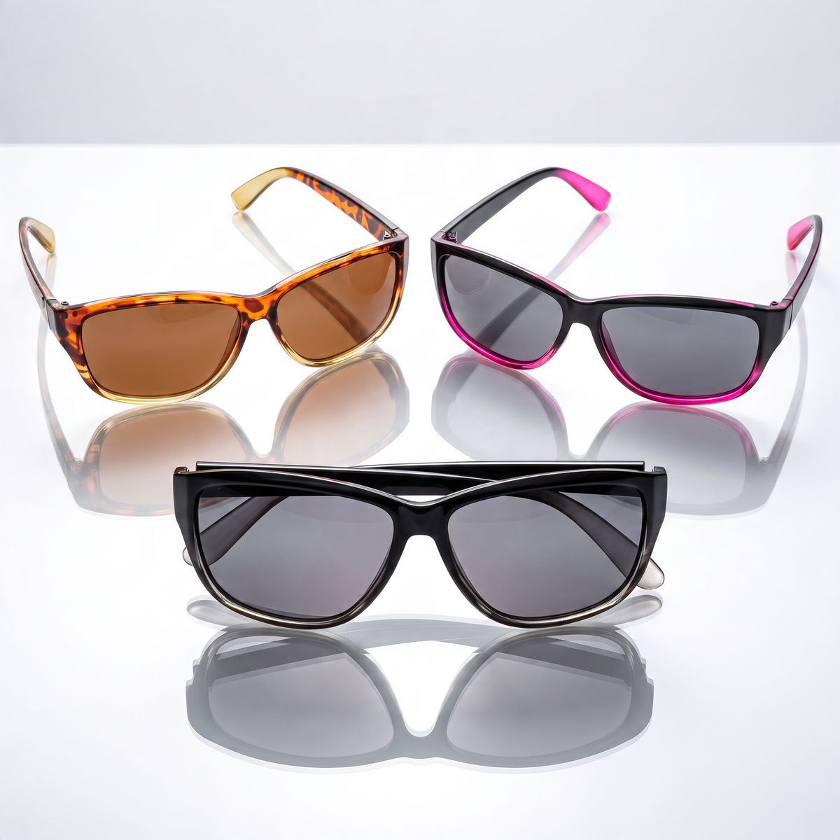 Eyelevel-UK Sophia rectangular polarized sunglasses in three colour combinations on a reflective white surface.