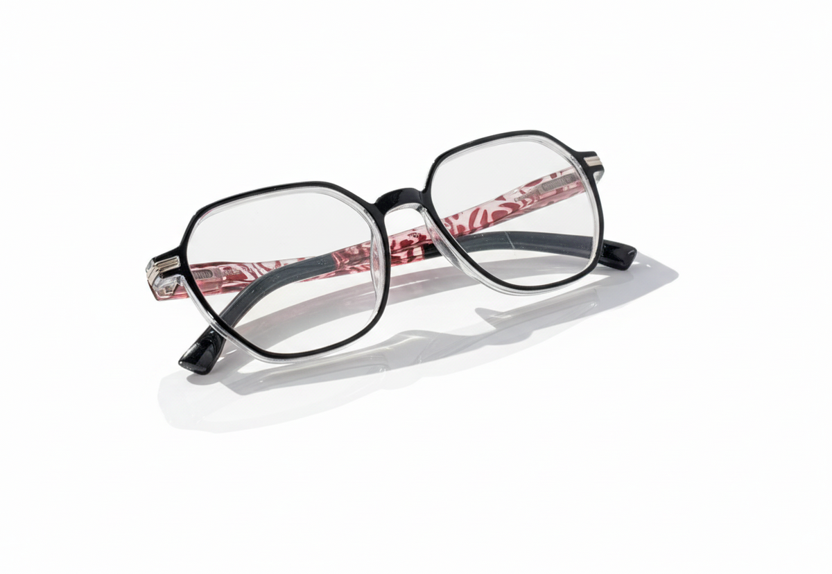 Eyelevel-UK St Kitts reading glasses with a translucent grey squared frame and patterned black and red temples.
