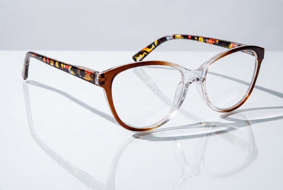 Eyelevel-UK St Lucia reading glasses with a brown and clear gradient cat eye frame and patterned temples.