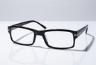 Eyelevel-UK Attorney black rectangular reading glasses with slim plastic frames and clear magnifying lenses.