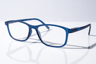 Eyelevel-UK Cambridge blue rectangular reading glasses with clear magnifying lenses on a reflective white surface.