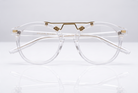 Eyelevel-UK Boston reading glasses with a transparent round frame and gold-tone bridge detailing on a white surface.