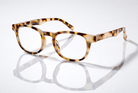 Eyelevel-UK Brazil reading glasses with a rounded light-tortoiseshell plastic frame and clear magnifying lenses.
