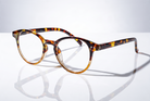 Eyelevel-UK Budapest reading glasses with a rounded brown tortoiseshell plastic frame and clear magnifying lenses.