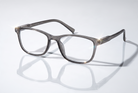 Eyelevel-UK Cambridge grey rectangular reading glasses with clear magnifying lenses on a reflective white surface