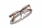 Eyelevel-UK Cayman reading glasses with a pale-pink squared frame and tortoiseshell detailing on a white background