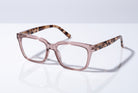 Eyelevel-UK Cayman reading glasses with a pale-pink squared frame and tortoiseshell-patterned temples on a white surface