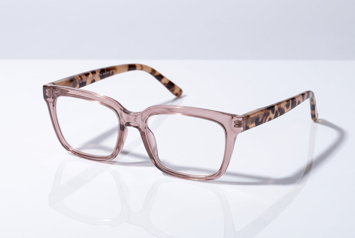 Eyelevel-UK Cayman reading glasses with a pale-pink squared frame and tortoiseshell-patterned temples on a white surface