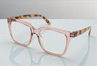 Eyelevel-UK Cayman reading glasses with a pale-pink squared frame and tortoiseshell-patterned arms on a white surface.