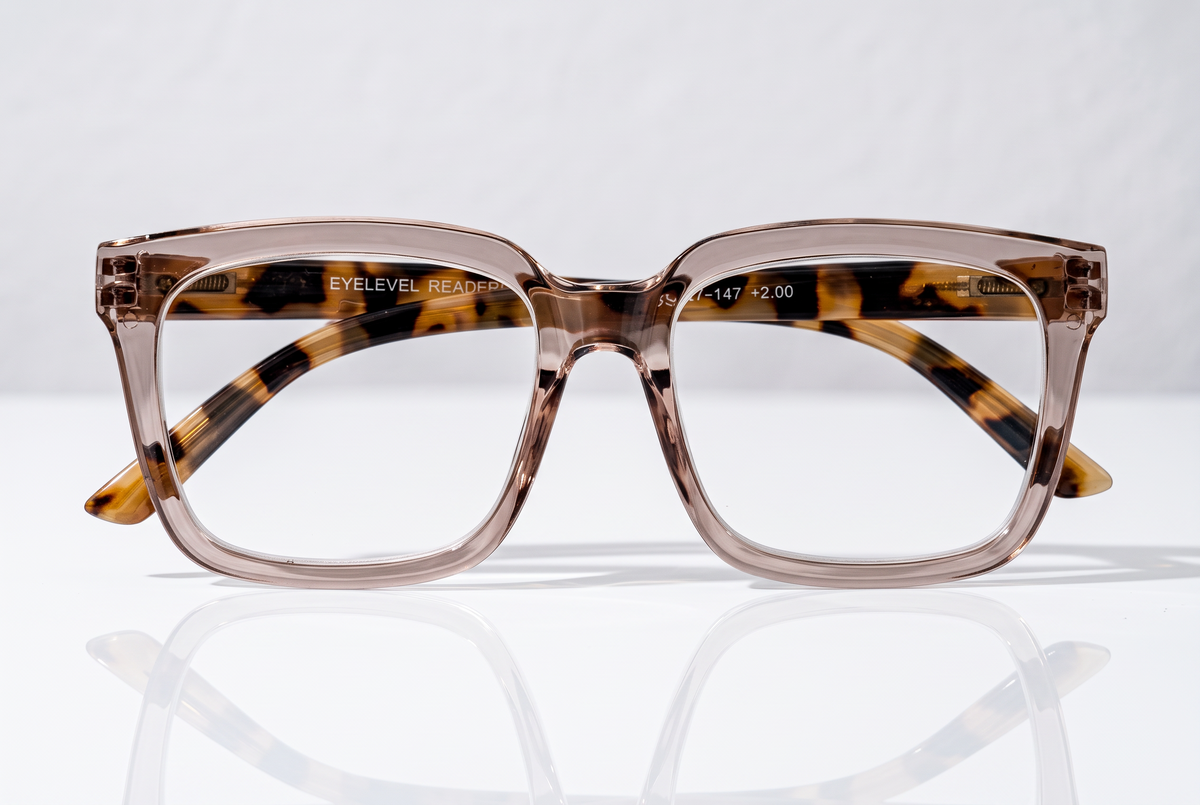 Eyelevel-UK Cayman reading glasses with a pale-pink squared frame and tortoiseshell-patterned inner detailing.