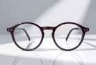 Eyelevel-UK Chelsea reading glasses with a classic black round plastic frame and clear magnifying lenses.