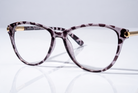 Eyelevel-UK Georgia reading glasses with a pink and black patterned square frame and gold-tone temple accents.