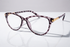 Eyelevel-UK Georgia reading glasses with a pink and black patterned squared frame and gold-tone temple accents.