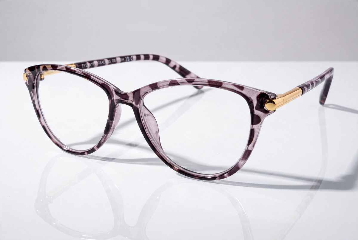 Eyelevel-UK Georgia reading glasses with a pink and black patterned squared frame and gold-tone temple accents.
