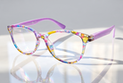 Eyelevel-UK Grenada reading glasses with a colourful lilac and yellow patterned frame and clear magnifying lenses
