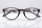 Eyelevel-UK Haiti reading glasses with a grey and white patterned oval frame and clear magnifying lenses.