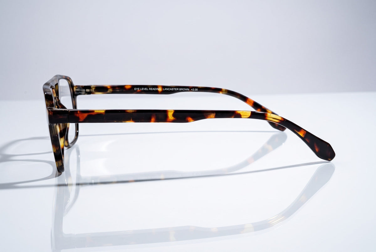 Eyelevel-UK Lancaster Brown reading glasses with a square tortoiseshell plastic frame, shown from a side profile view.