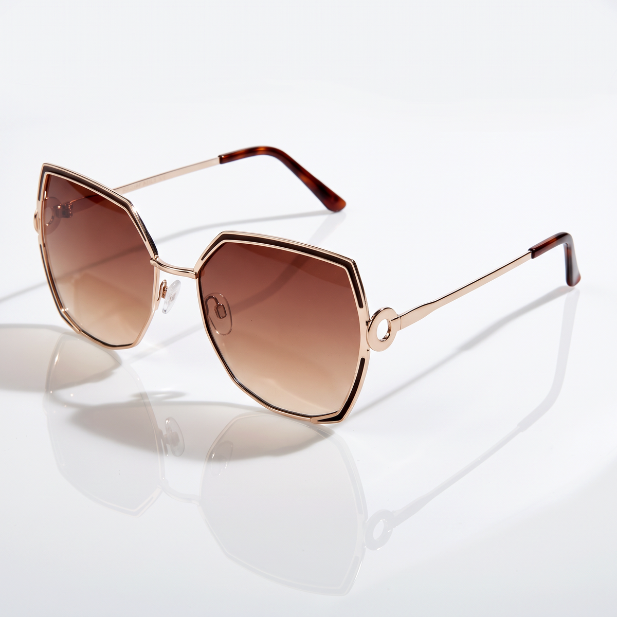 Eyelevel-UK Lauren geometric ladies sunglasses in light gold with brown gradient lenses and brown temple tips.
