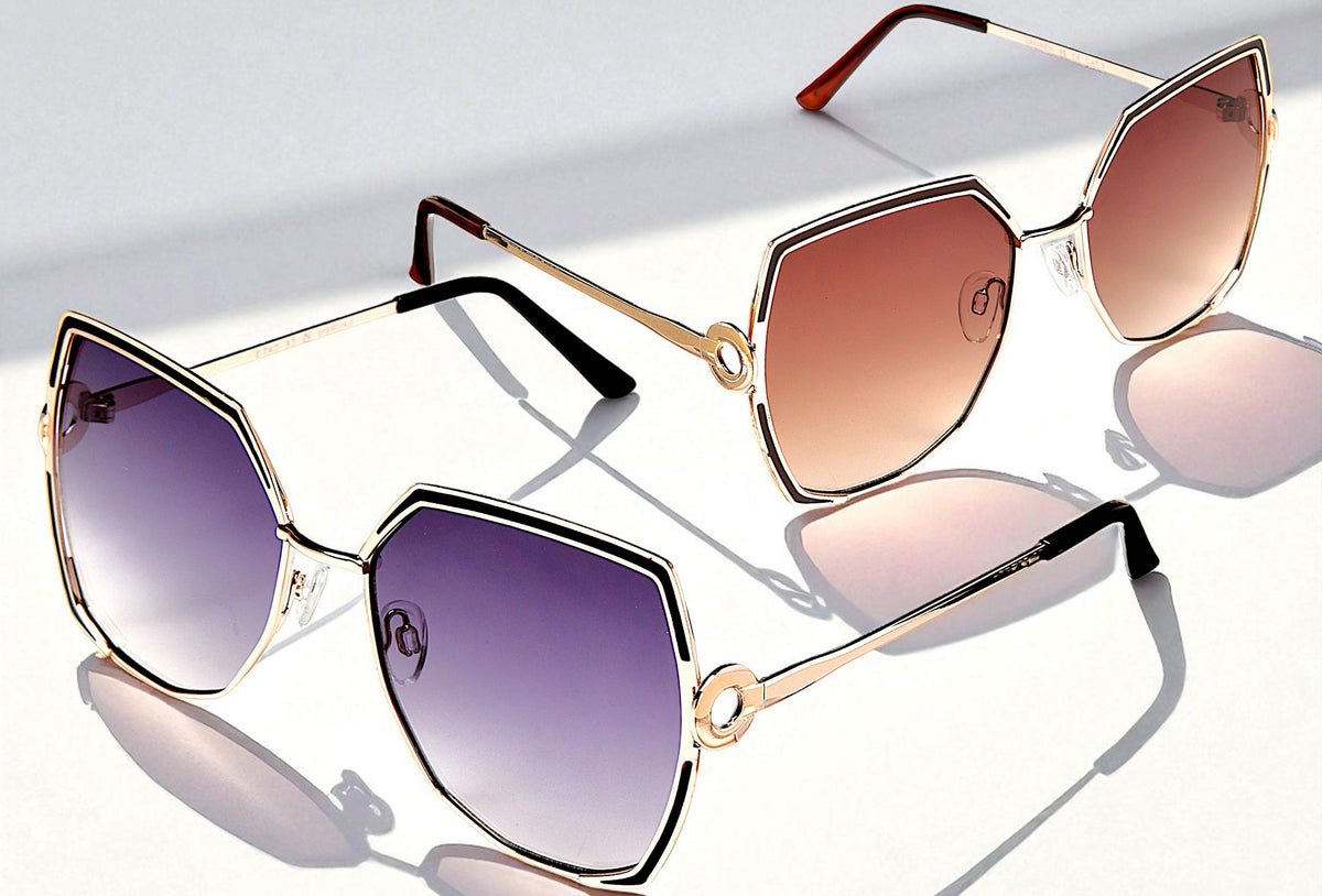 Eyelevel-UK Lauren geometric ladies sunglasses in light gold with grey and brown gradient lenses on a white surface
