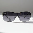 Eyelevel-UK Lois wraparound fashion sunglasses in black and silver with stone lens embellishments and gradient lenses.