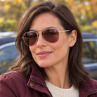 Woman wearing Eyelevel-UK Monte Carlo polarized driving sunglasses with silver frames and copper lenses outdoors.