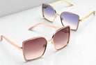 Eyelevel-UK Mya oversized geometric sunglasses in rose gold with pink and grey gradient lenses on a white surface