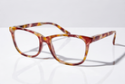 Eyelevel-UK Naples reading glasses with a brown and multicolour tortoiseshell square plastic frame on white surface