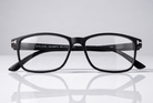 Eyelevel-UK Nelson reading glasses with a black square plastic frame and clear magnifying lenses on a white surface.