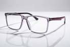 Eyelevel-UK Newton reading glasses with a grey transparent square frame and clear magnifying lenses.