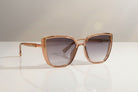 Eyelevel-UK Nicole oversized sunglasses with a brown crystal frame and grey gradient lenses for UV400 protection.