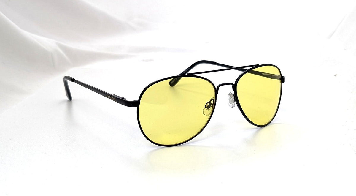 Eyelevel-UK Night Driver 1 sunglasses featuring a black metal aviator frame and yellow lenses for low-light driving.