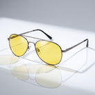 Eyelevel-UK Night Driver 1 sunglasses with gunmetal aviator frames and yellow lenses for low-light driving conditions.