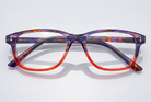 Eyelevel-UK Immaculate reading glasses with a softly squared, orange and purple patterned plastic frame.