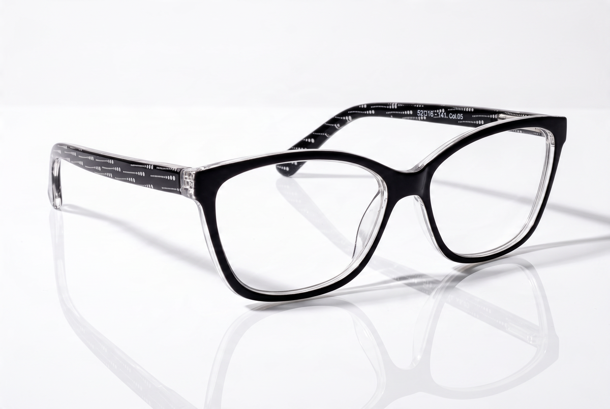 Eyelevel-UK Oslo reading glasses with a black and white squared frame and patterned temples on a reflective surface.