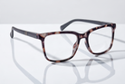 Eyelevel-UK Oxford reading glasses with a brown tortoiseshell and matte black squared plastic frame on a white surface