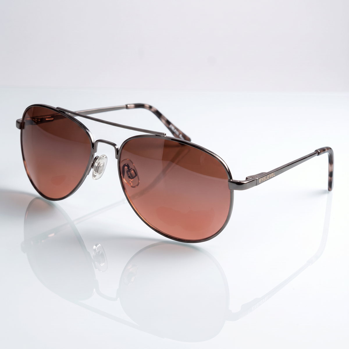 Eyelevel-UK Roadster driving sunglasses with gunmetal frames, tortoiseshell arms, and high-density brown lenses.