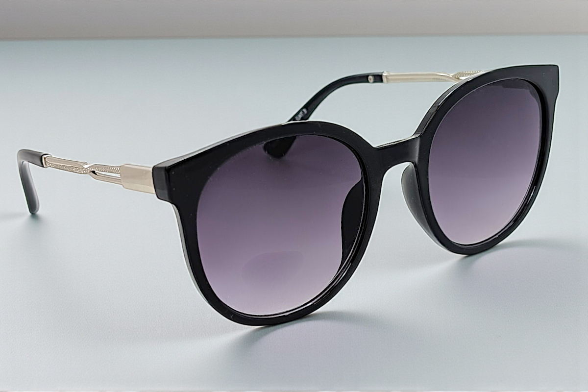 Eyelevel-UK Robyn oversized round sunglasses with black frames, silver temples, and grey gradient UV400 lenses.