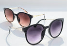 Eyelevel-UK Robyn oversized round sunglasses in brown tortoiseshell and black with gradient lenses on a white surface.